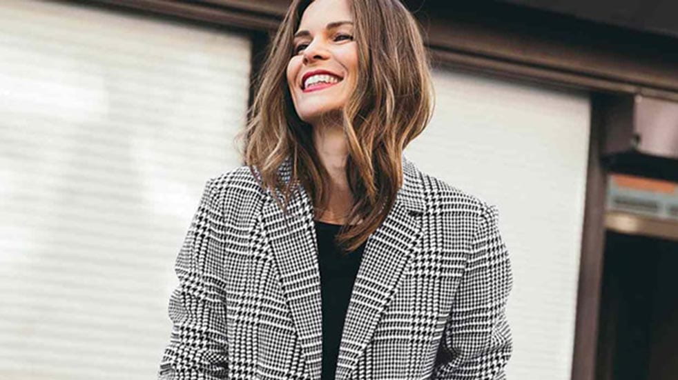 10 easy ways to boost your mood this autumn woman smiling in coat